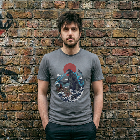Graphic tee featuring a retro Japanese Ukiyo-e wave, Mount Fuji, and a giant Kaiju monster breathing atomic blue fire.