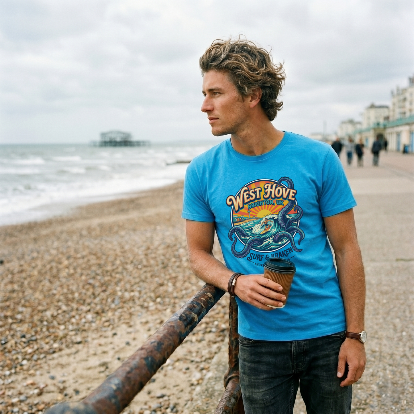 Graphic tee featuring a surfer riding a wave inside a giant kraken's tentacles with "West Hove" retro text
