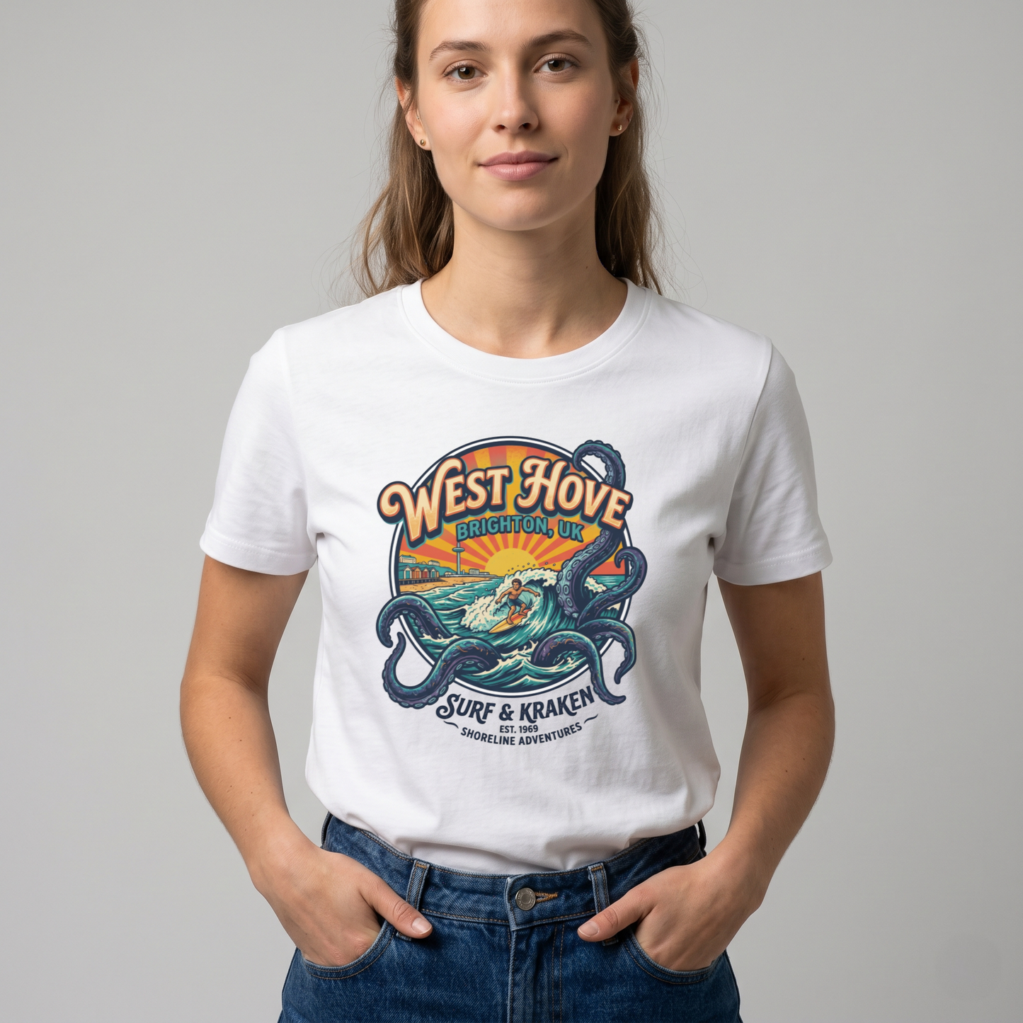 Graphic tee featuring a surfer riding a wave inside a giant kraken's tentacles with "West Hove" retro text