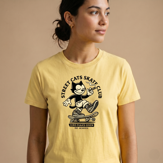 Retro rubber-hose cartoon cat skateboarding and smoking a cigar with Street Cats Skate Club text on organic cotton t-shirt.